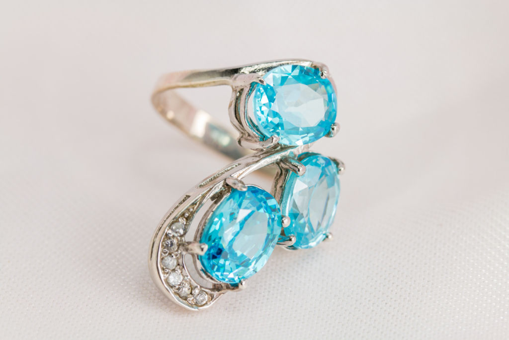 Old silver ring with blue topaz gemstone