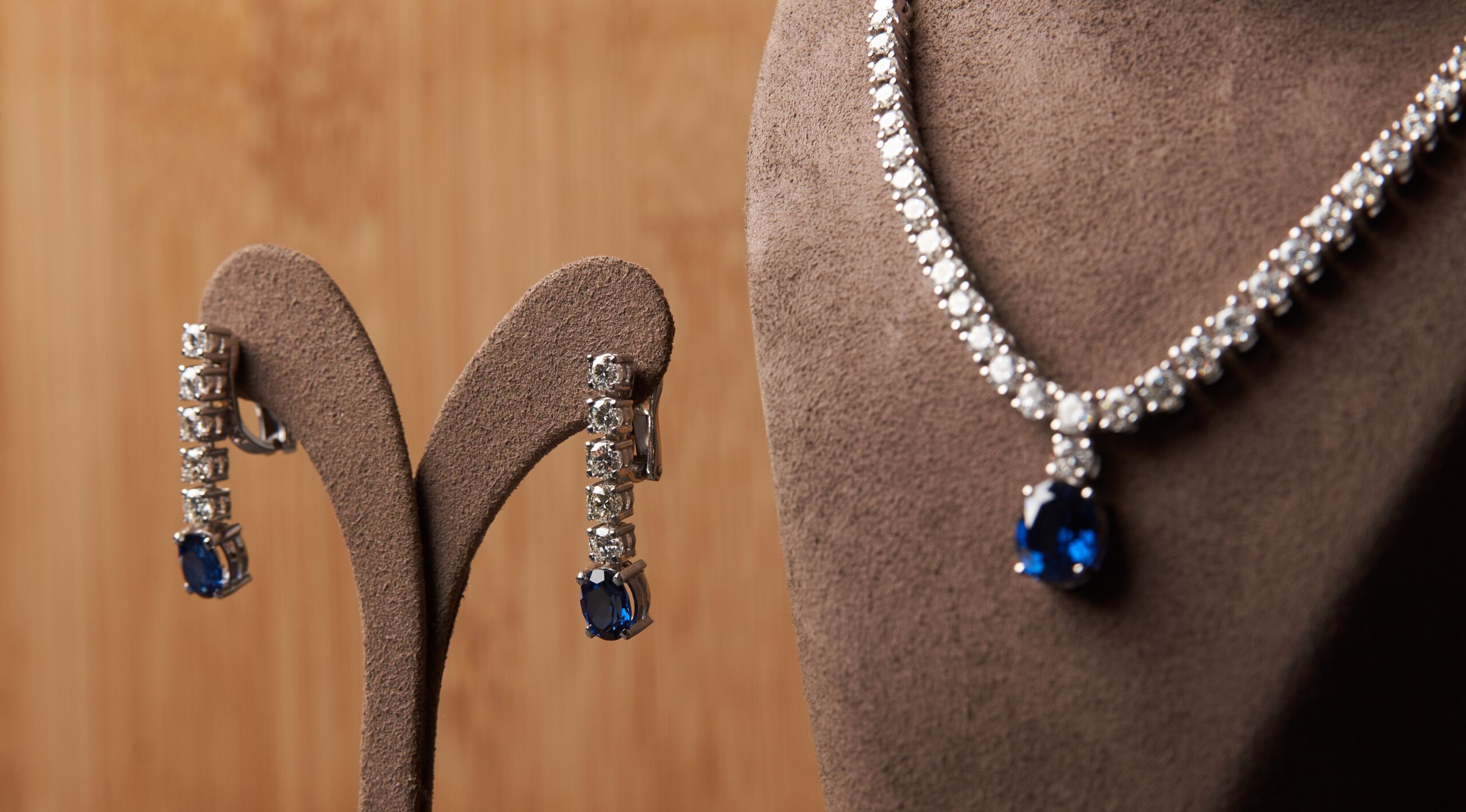 Image of Blue sapphire platinum necklace and earrings with a diamond and blue precious sapphire stone