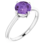 a close up of a natural amethyst solitaire ring